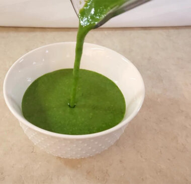 This is a photo of my pouring my Spinach Pesto into a bowl after blending it.