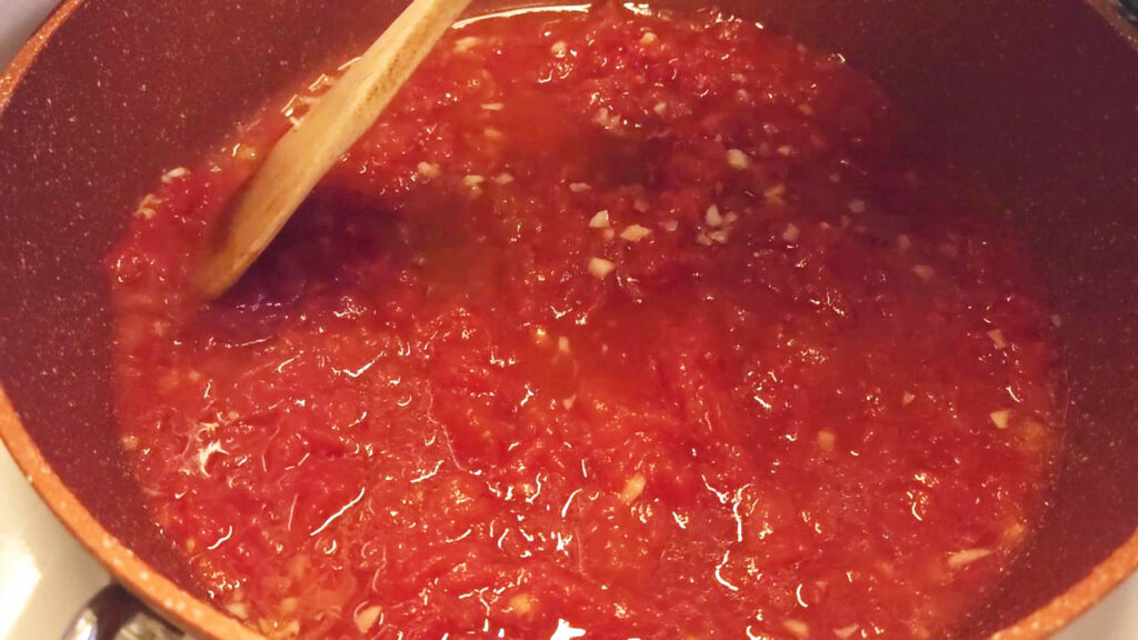 this photo shows the sauce simmering